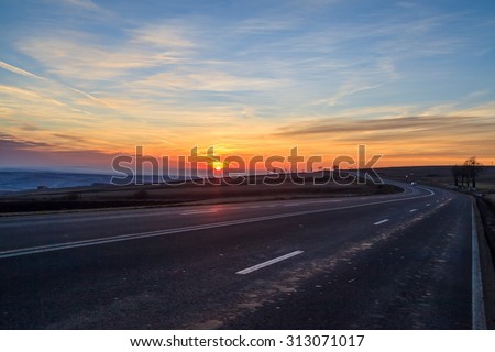 Picturesque photo of country road and sunset
