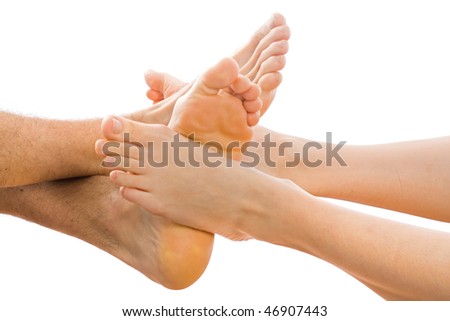 Young couple putting together the feet in the studio