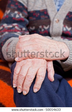 Old man staying alone at home whit holding hands