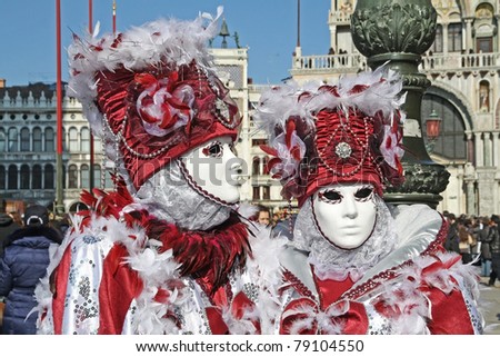 VENICE, ITALY - MARCH 4: Unidentified masked persons stand on San Marco square during the Venice Carnival on March 4, 2011 in Venice, Italy. The carnival is from February 26 - March 8, 2011.