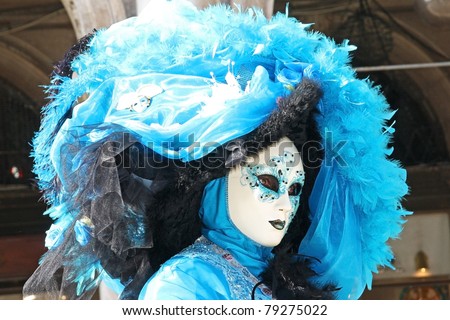 VENICE, ITALY - MARCH 4: An unidentified masked person stands in front of Palazzo Ducale during the Venice Carnival on March 4, 2011 in Venice, Italy. The carnival is from February 26 - March 8, 2011.