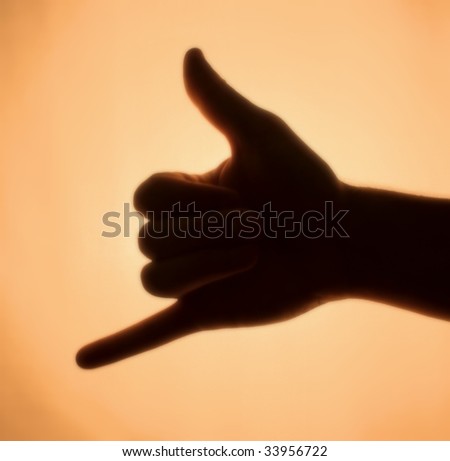 Back-lit hand signaling \'call me\'