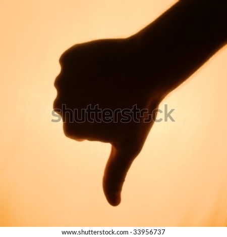 Back-lit hand signaling 'thumbs-down'