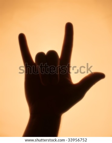 Back-lit hand signaling \'what\'s up\'