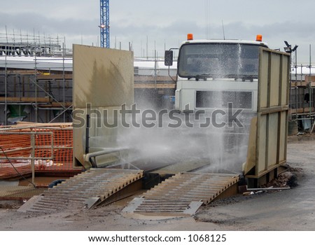 Truck entering a construction site chassis wash