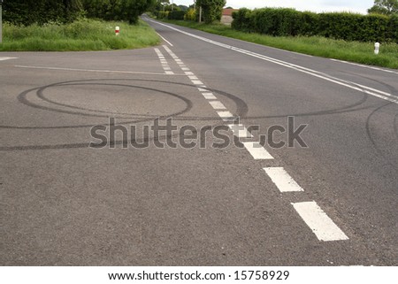 Skid marks on a quiet rural road left by bored teenage drivers