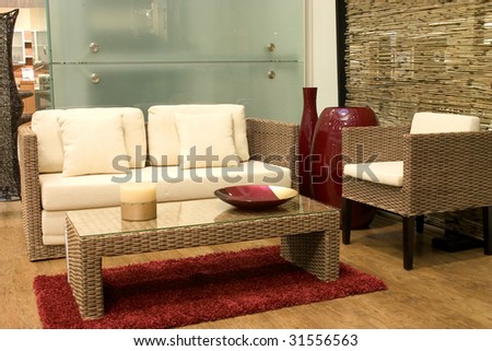 Modern living room with sofas from rattan and arm chair.