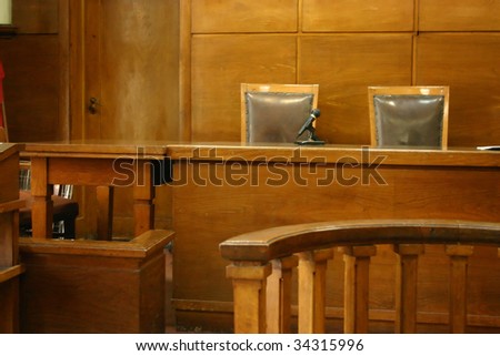 Classical court room with 2 chairs, wooden bench and interior.