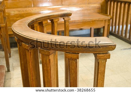 Wooden court bench. Vintage style court room close up.