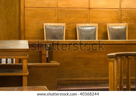 Old vintage court room. Close-up of the judges chairs.