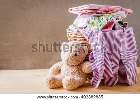 Clothes in a laundry basket on Wood floor