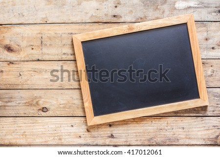 Blackboard on wood old wall