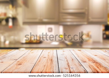 Empty wooden table and blurred kitchen background for display or montage your products