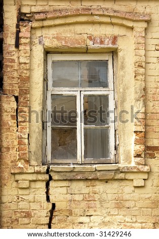 Smashed window in the old brick house
