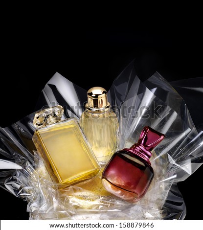 Generic Perfume Bottles In A Gift Set On Black Background