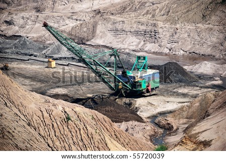 Excavator in amber pit