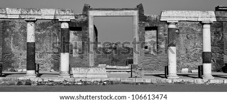 Latin engraved stone pillars in Pompeii ruins, Italy, Europe. black and White