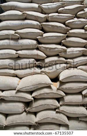 Wall of rice sacks in grain factory, Vietnam