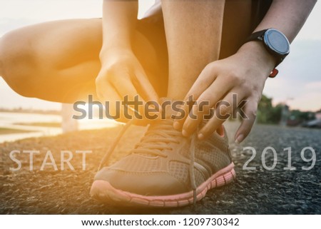 2019 the start into the new year.sports background. legs of runner feet running on road