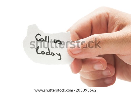 Call us today message concept  using a hand holding a small piece of paper on white background