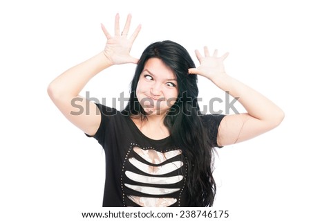 Teen girl making funny face with crossed eyes