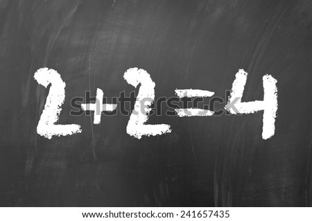 2 plus 2 equals 4 simple math problem solved on a school blackboard