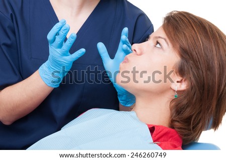 Stubborn patient in dentist office who don\'t want to open the mouth