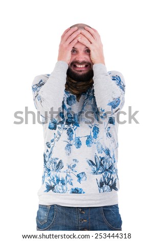 Man making a crazy desperation face by grabbing his head