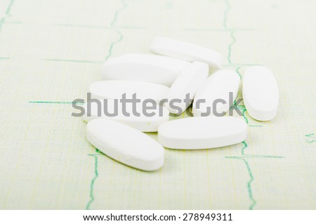 Few heart pills on ekg or cardiogram