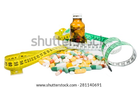 Weight loss using pills concept witj meter and bottle of tablets
