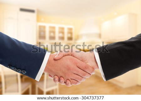 Buy or sale real estate concept with businessmen handshake. Realtor and client or buyer and seller