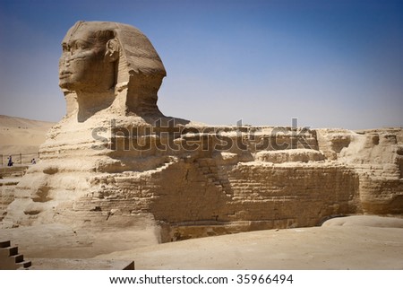 The Great Sphinx of Giza is a statue of a reclining lion with a human head that stands on the Giza Plateau  near Cairo, in Egnypt. It is the largest monolith statue in the world