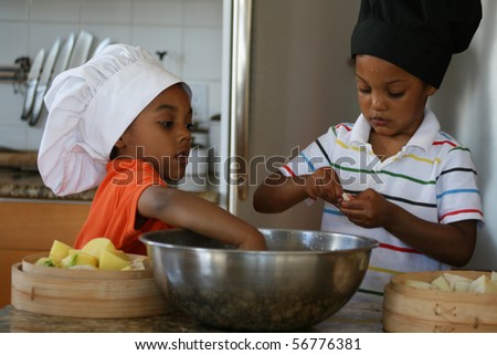 Young brothers preparing a delicious meal.
