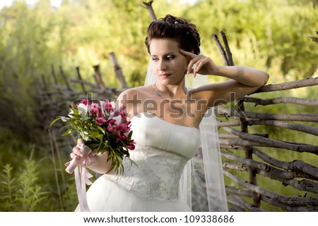 horizontal wedding portrait beautifull  fiancee in white dress with wedding veil, on nature