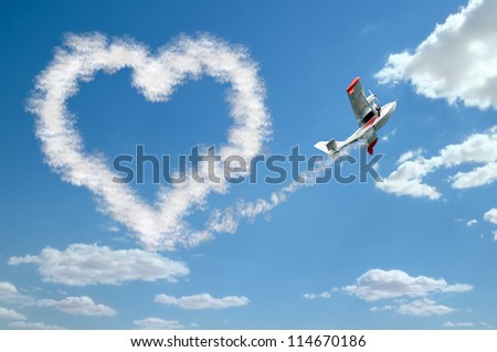 twin-engine hydroplane flight in sky and draw white heart of  clouds