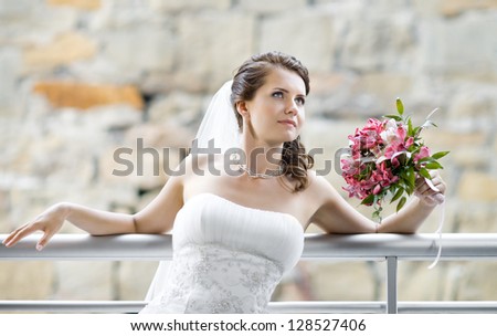 horizontal wedding portrait beautiful  fiancee with  bouquet  in white dress
