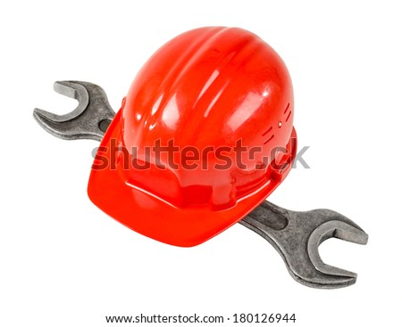 photo  red  safety cap and steel  wrench, close up on white background, full face
