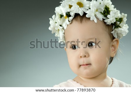 very beautiful  little kid with diadem of flowers, stare , very closeup face