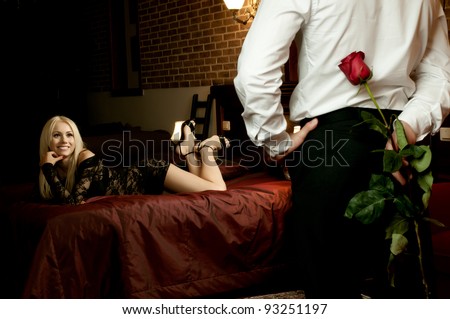 http://image.shutterstock.com/display_pic_with_logo/419500/419500,1327175668,33/stock-photo-romantic-evening-date-in-hotel-room-guy-with-red-rose-and-sexy-girl-in-bedroom-93251197.jpg