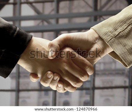 Handshake in the office, the conclusion of the contract.