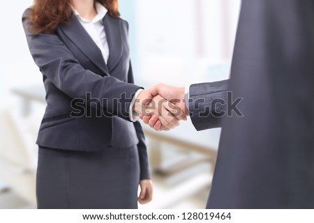 Handshake businessmen in the office.