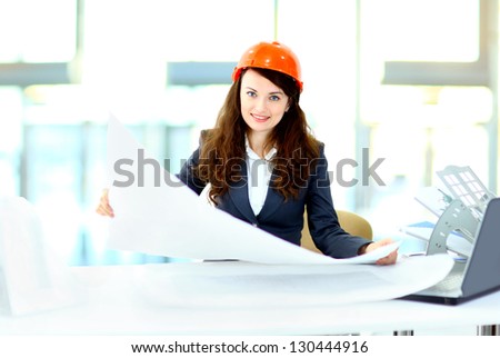 Beautiful businesswoman engineer with the work-plan office.