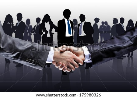 Close-Up Of Business People Shaking Hands To Confirm Their Partnership