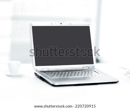 Demonstration of a laptop in the office of the front view.
