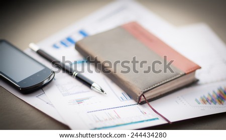 personal organizer and pen on office desk