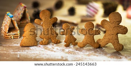 gingerbread men on the wooden floor with Christmas decorations
