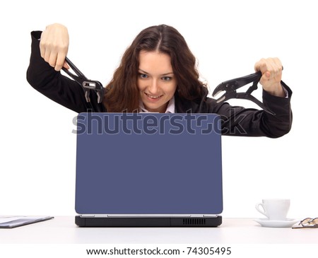 Young woman about to break the computer. A part of the office rage series.