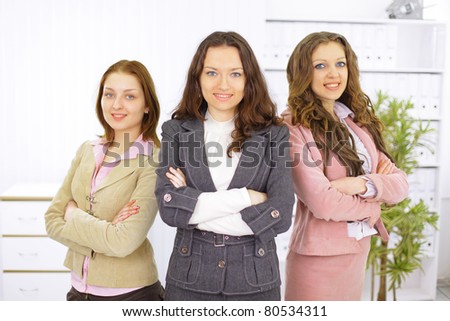 Portrait of a stylish young businesswoman with her successful business team at office