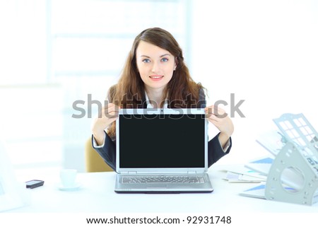 Nice business woman in the office, representation of the laptop.