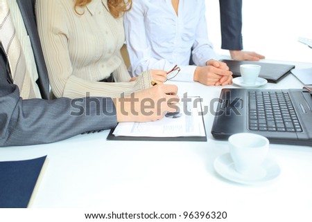 Beautiful businesswoman keeps the laptop. Isolated on a white background.